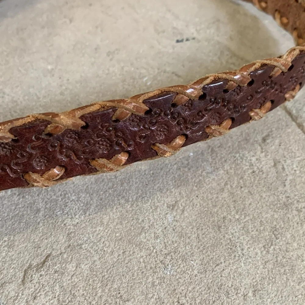 Leather tooled size small belt with wooden buckle